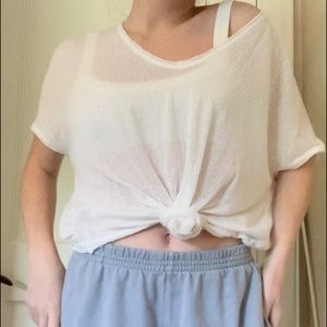 Out From Under Urban Outfitter’s White Top